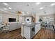 Spacious living area open to the kitchen with a seamless flow to the dining room creating a functional layout at 4542 Cedar Brush Ter, Sarasota, FL 34243