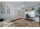 Comfortable office space featuring French doors and a serene color palette at 4542 Cedar Brush Ter, Sarasota, FL 34243