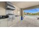 Outdoor kitchen featuring a stainless steel grill and countertop space, conveniently located next to a community pool at 4542 Cedar Brush Ter, Sarasota, FL 34243