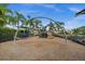 Community playground featuring slides, climbing structures, and swings at 4542 Cedar Brush Ter, Sarasota, FL 34243