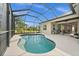 Private backyard oasis with a screened pool, patio, and serene outdoor seating, perfect for relaxation and gatherings at 4542 Cedar Brush Ter, Sarasota, FL 34243