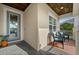 Inviting front porch featuring comfortable seating and a stylish front door, creating a warm welcome at 4542 Cedar Brush Ter, Sarasota, FL 34243
