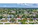 Aerial view of a house in a neighborhood with mature trees and beautiful landscape at 5126 15Th W Ave, Bradenton, FL 34209