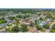 Aerial view of a house in a beautiful neighborhood with a nearby pond at 5126 15Th W Ave, Bradenton, FL 34209