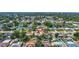 Aerial view of a house in a quiet residential area with mature trees and beautiful landscape at 5126 15Th W Ave, Bradenton, FL 34209