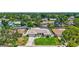 Inviting home showcasing its manicured lawn and landscaping, set amidst a lush, tree-filled neighborhood at 5126 15Th W Ave, Bradenton, FL 34209