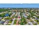 Aerial view of the community and a house with a beautiful landscape and a pool at 5126 15Th W Ave, Bradenton, FL 34209