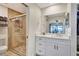 Clean bathroom featuring a vanity and a tiled walk-in shower with glass doors at 5126 15Th W Ave, Bradenton, FL 34209