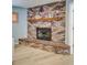 Inviting brick fireplace with mantel and decorative banner in the living room at 5126 15Th W Ave, Bradenton, FL 34209