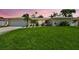 Charming single-story home featuring a well-manicured lawn, complemented by lush landscaping and a two car garage at 5126 15Th W Ave, Bradenton, FL 34209
