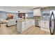 Bright kitchen showcasing granite countertops, stainless steel appliances, white cabinets, and an open layout at 5126 15Th W Ave, Bradenton, FL 34209