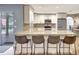 Bright kitchen featuring granite countertops, stainless steel appliances, a breakfast bar and white cabinets at 5126 15Th W Ave, Bradenton, FL 34209