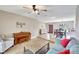 Spacious living room featuring hardwood floors, a piano, and lots of natural light at 5126 15Th W Ave, Bradenton, FL 34209
