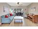 Inviting living room with comfortable seating, a piano, and sliding doors leading to the screened-in patio and pool at 5126 15Th W Ave, Bradenton, FL 34209