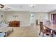 Spacious living room featuring hardwood floors, a piano, and a decorative archway at 5126 15Th W Ave, Bradenton, FL 34209