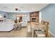 Cozy living room with a brick fireplace, light blue walls, wood-look floors, and comfortable seating at 5126 15Th W Ave, Bradenton, FL 34209