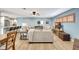 Comfortable living room featuring light blue walls, ceiling fan, and ample natural light at 5126 15Th W Ave, Bradenton, FL 34209