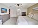 Spacious bedroom featuring carpeting, ensuite bathroom and mounted TV at 5126 15Th W Ave, Bradenton, FL 34209