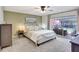 Cozy bedroom with a king bed and sliding doors to the pool area at 5126 15Th W Ave, Bradenton, FL 34209