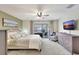 Well-lit bedroom with carpet, furnishings, and sliding door access to the patio at 5126 15Th W Ave, Bradenton, FL 34209