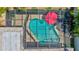 Aerial view of a screened-in pool with an umbrella and clear blue water at 5126 15Th W Ave, Bradenton, FL 34209