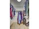 Organized walk-in closet with clothes racks and tiled flooring at 5126 15Th W Ave, Bradenton, FL 34209