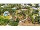 Aerial view of the property showcasing its expansive lot, mature trees, and private setting at 5204 24Th E Ave, Palmetto, FL 34221