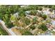 Expansive aerial view of a property with mature trees, pool, and separate garage at 5204 24Th E Ave, Palmetto, FL 34221