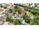 Aerial view of property with a pool, trees, large lot, and proximity to residential areas at 5204 24Th E Ave, Palmetto, FL 34221
