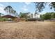 Large backyard featuring a screened-in pool and covered parking area, ideal for entertaining and relaxation at 5204 24Th E Ave, Palmetto, FL 34221