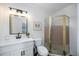 Clean bathroom featuring a walk-in shower with a gold frame at 5204 24Th E Ave, Palmetto, FL 34221