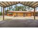 View of back of house from under carport, showing the backyard and ample parking at 5204 24Th E Ave, Palmetto, FL 34221