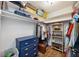 A well-organized walk-in closet with built-in shelving, drawers, and plenty of hanging space for clothes and storage at 5204 24Th E Ave, Palmetto, FL 34221