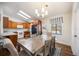 Cozy dining area with views of the backyard pool, with modern light fixture overhead at 5204 24Th E Ave, Palmetto, FL 34221