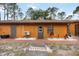 Exterior view of property featuring a private entrance, brick walkway and mature landscaping at 5204 24Th E Ave, Palmetto, FL 34221