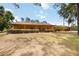 Charming ranch-style home with a covered porch and mature landscaping offering great curb appeal at 5204 24Th E Ave, Palmetto, FL 34221