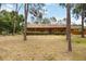 Charming single-story home with a covered front porch nestled among mature trees at 5204 24Th E Ave, Palmetto, FL 34221