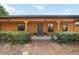 Welcoming front entrance with a cozy porch and well-maintained landscaping offering curb appeal at 5204 24Th E Ave, Palmetto, FL 34221