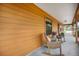 Inviting covered front porch with rocking chairs, perfect for relaxing outdoors at 5204 24Th E Ave, Palmetto, FL 34221
