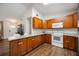 Well-equipped kitchen featuring wood cabinets and granite countertops at 5204 24Th E Ave, Palmetto, FL 34221