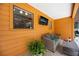 Cozy patio area with comfortable seating and mounted television, perfect for relaxing at 5204 24Th E Ave, Palmetto, FL 34221