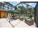 Screened-in patio and pool area with outdoor seating and well maintained lawn at 5204 24Th E Ave, Palmetto, FL 34221