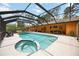 Inviting screened-in pool and spa area, perfect for outdoor enjoyment and relaxation at 5204 24Th E Ave, Palmetto, FL 34221