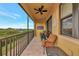 Relax on this inviting balcony with river views and comfortable outdoor seating arrangements at 5561 Cannes Cir # 5101, Sarasota, FL 34231
