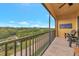 Enjoy beautiful green scenery from this balcony with railings and comfortable seating at 5561 Cannes Cir # 5101, Sarasota, FL 34231