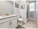 Well-lit bathroom featuring a vanity with modern fixtures and a glass-enclosed shower at 5561 Cannes Cir # 5101, Sarasota, FL 34231