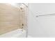 Bright bathroom featuring a bathtub and white shower at 5561 Cannes Cir # 5101, Sarasota, FL 34231