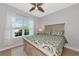Bedroom featuring a queen bed, light neutral walls, and bright natural lighting at 5561 Cannes Cir # 5101, Sarasota, FL 34231