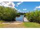 Community boat ramp with dock access and verdant landscaping at 5561 Cannes Cir # 5101, Sarasota, FL 34231