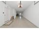 Spacious two car garage with white walls, neutral floor, and extra storage space at 5561 Cannes Cir # 5101, Sarasota, FL 34231